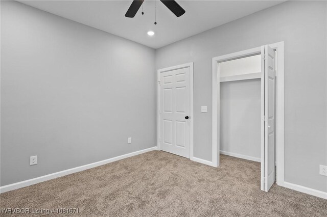 179 E Grove St, Magazine, AR 72943 - unfurnished bedroom featuring carpet flooring, recessed lighting, and a ceiling fan