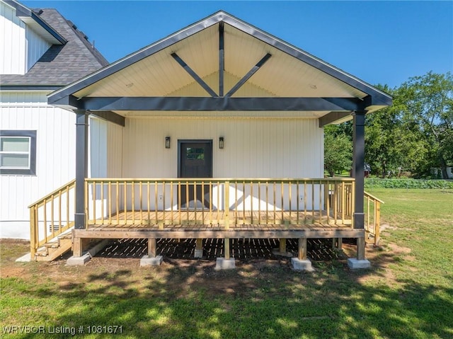 179 E Grove St, Magazine, AR 72943 - view of front of house featuring a front yard, roof with shingles, and a deck