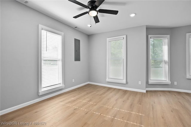 179 E Grove St, Magazine, AR 72943 - unfurnished room with light wood finished floors, electric panel, a ceiling fan, and recessed lighting