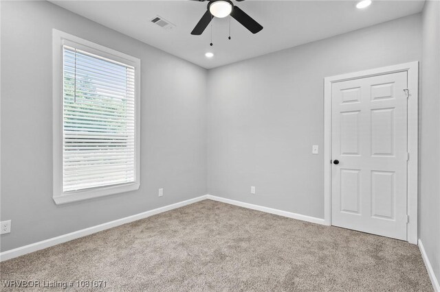 179 E Grove St, Magazine, AR 72943 - empty room featuring carpet, ceiling fan, and recessed lighting
