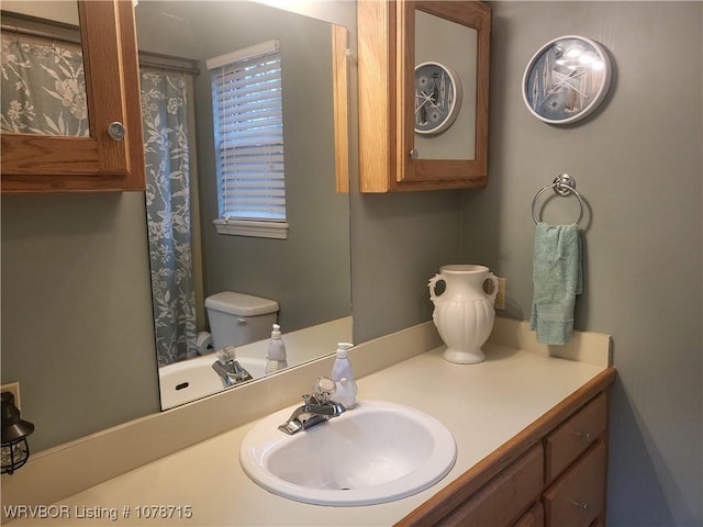 bathroom with vanity and toilet