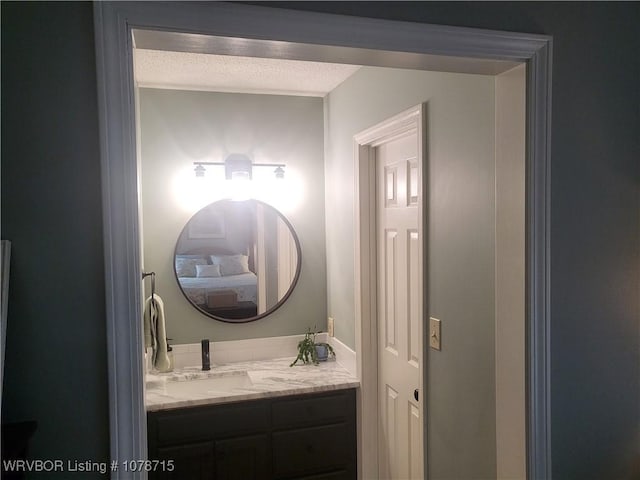 bathroom featuring vanity and a textured ceiling