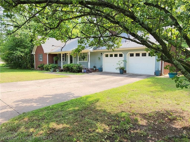 single story home featuring a garage and a front yard