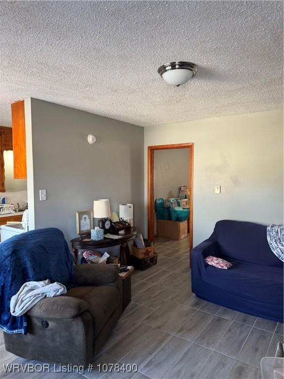 living room with a textured ceiling