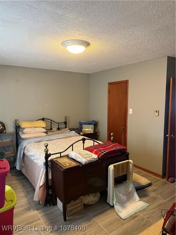 bedroom with a textured ceiling