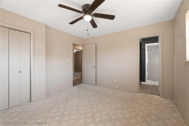 unfurnished bedroom featuring carpet floors, a closet, baseboards, and a ceiling fan
