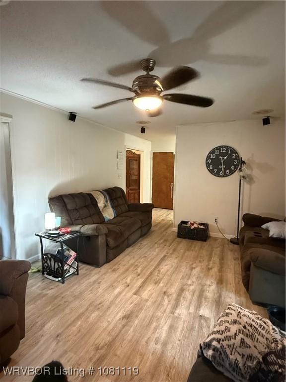 2303 Willow St, Van Buren, AR 72956 - living area featuring wood finished floors and a ceiling fan