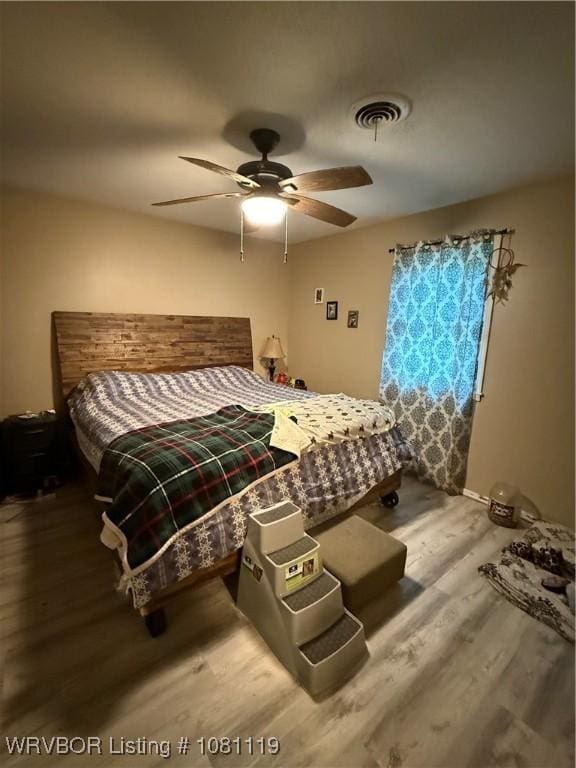 2303 Willow St, Van Buren, AR 72956 - bedroom featuring wood finished floors and ceiling fan