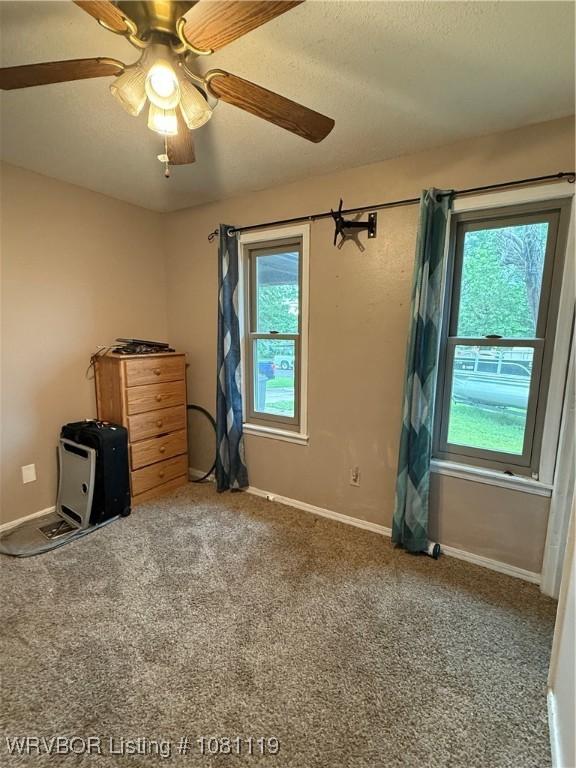 2303 Willow St, Van Buren, AR 72956 - spare room featuring healthy amount of natural light, ceiling fan, carpet, and a textured ceiling