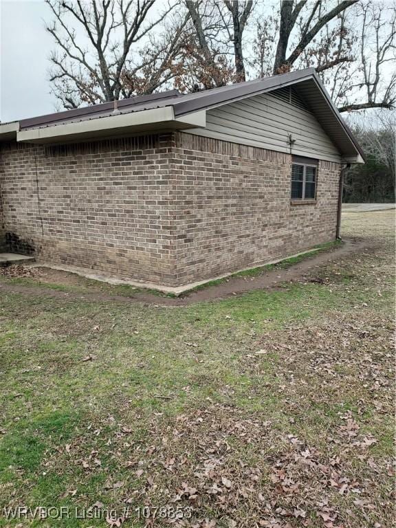 view of home's exterior featuring a yard