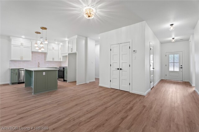 9005 Carson Way, Fort Smith, AR 72908 - kitchen featuring a sink, white cabinets, stainless steel appliances, and light wood-style flooring