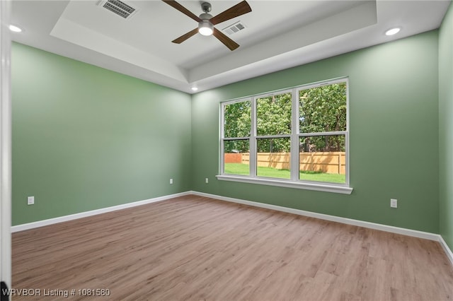 9005 Carson Way, Fort Smith, AR 72908 - spare room featuring a raised ceiling, wood finished floors, ceiling fan, baseboards, and recessed lighting