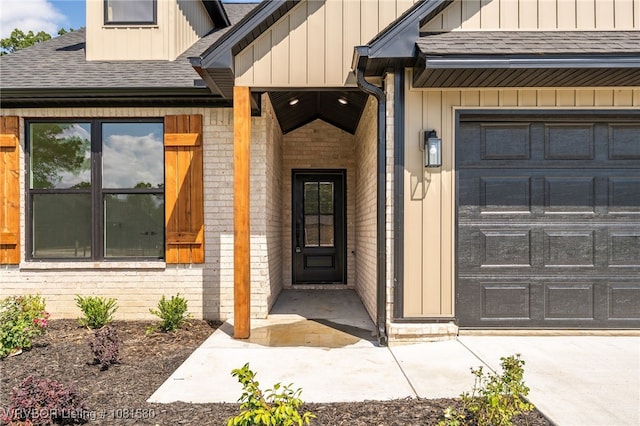 9005 Carson Way, Fort Smith, AR 72908 - view of exterior entry with board and batten siding, roof with shingles, and brick siding