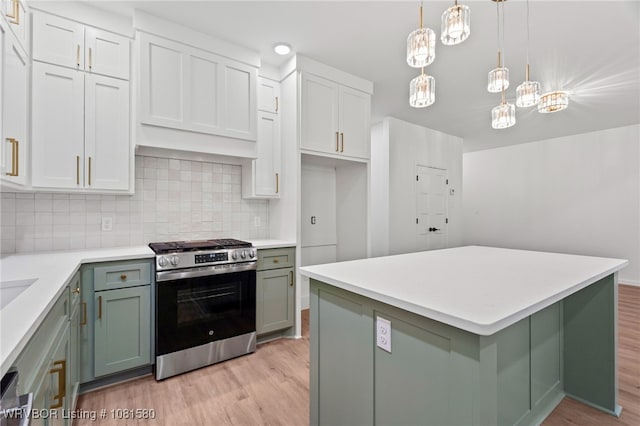 9005 Carson Way, Fort Smith, AR 72908 - kitchen with stainless steel gas range, light wood-style floors, light countertops, and tasteful backsplash