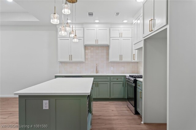 9005 Carson Way, Fort Smith, AR 72908 - kitchen featuring green cabinetry, range with gas cooktop, a sink, light countertops, and light wood-style flooring