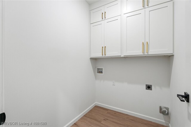 9005 Carson Way, Fort Smith, AR 72908 - laundry room with cabinet space, hookup for an electric dryer, washer hookup, baseboards, and wood finished floors