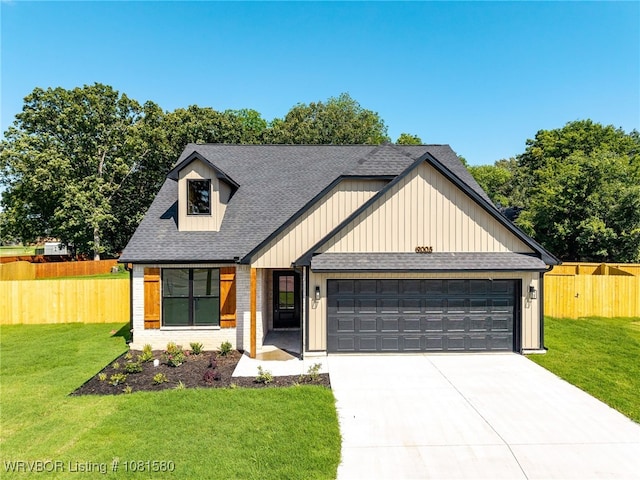 9005 Carson Way, Fort Smith, AR 72908 - view of front of home featuring an attached garage, roof with shingles, driveway, brick siding, and board and batten siding
