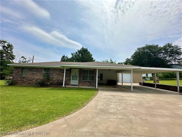 105 7th St, Paris, AR 72855 - view of front of home featuring an attached carport, a front yard, and driveway