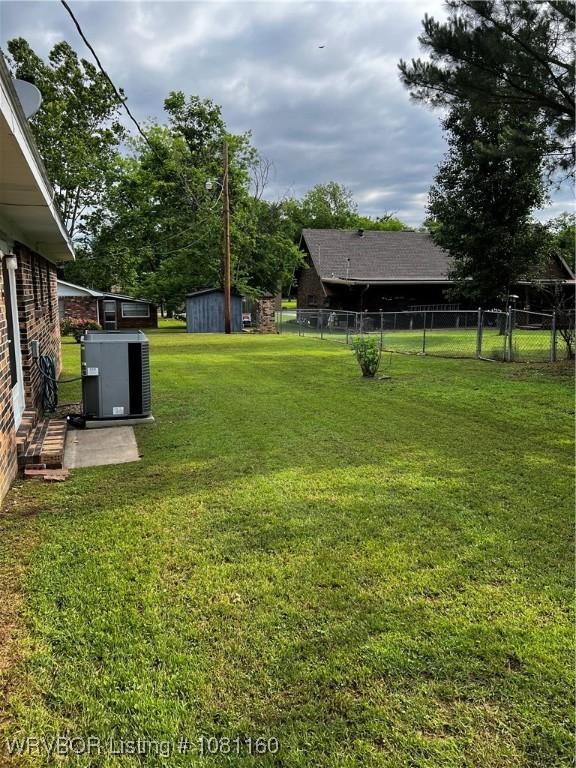 105 7th St, Paris, AR 72855 - view of yard featuring a storage unit