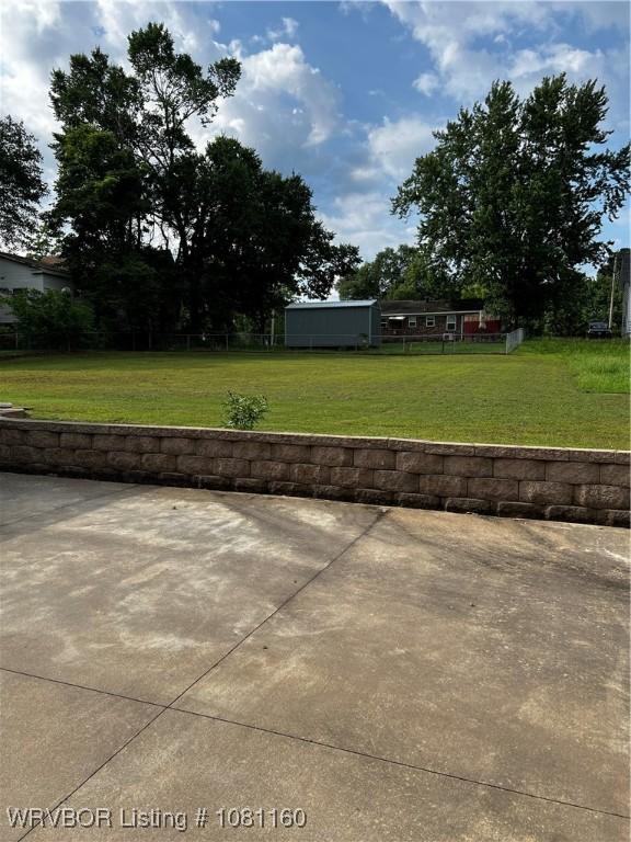 105 7th St, Paris, AR 72855 - view of green lawn featuring a patio area