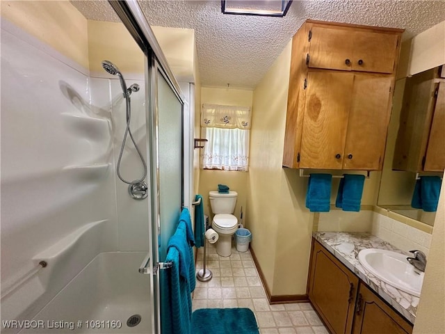 105 7th St, Paris, AR 72855 - full bathroom with a textured ceiling, a shower stall, and vanity
