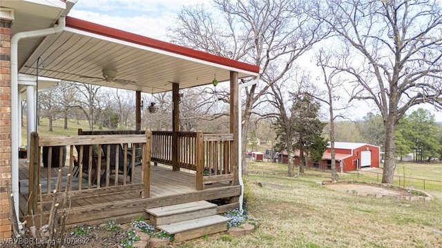 wooden terrace with fence and a yard