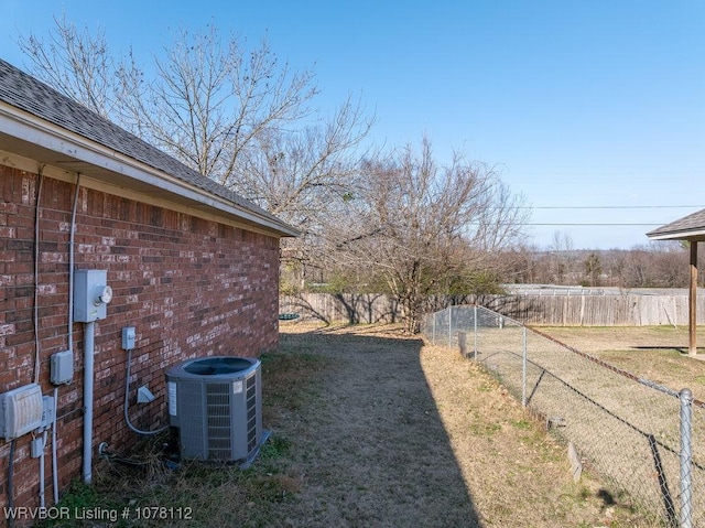 view of yard featuring central air condition unit