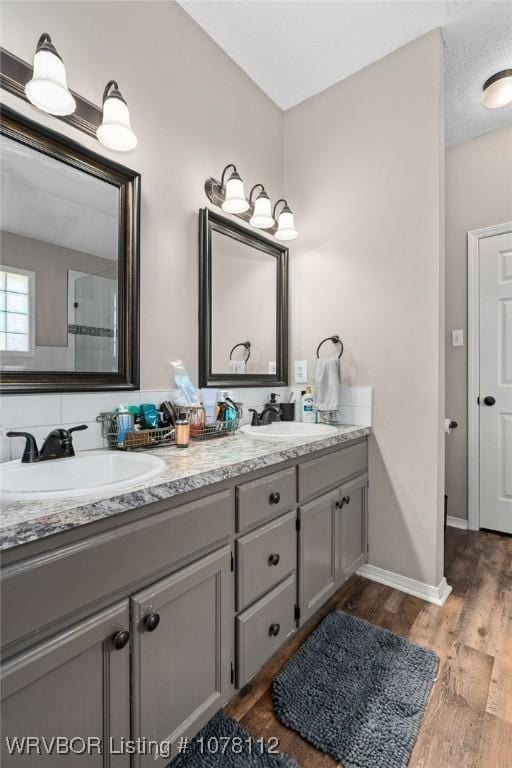 bathroom featuring hardwood / wood-style floors and vanity