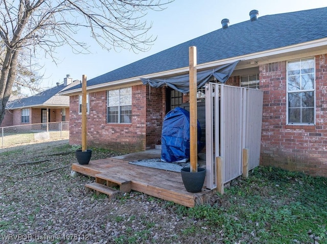 back of house featuring a wooden deck