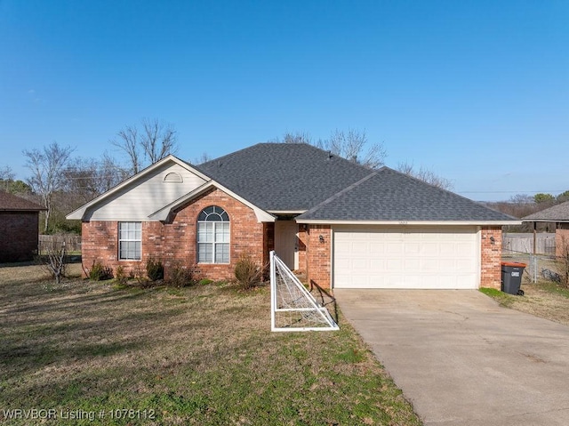 single story home with a garage and a front lawn