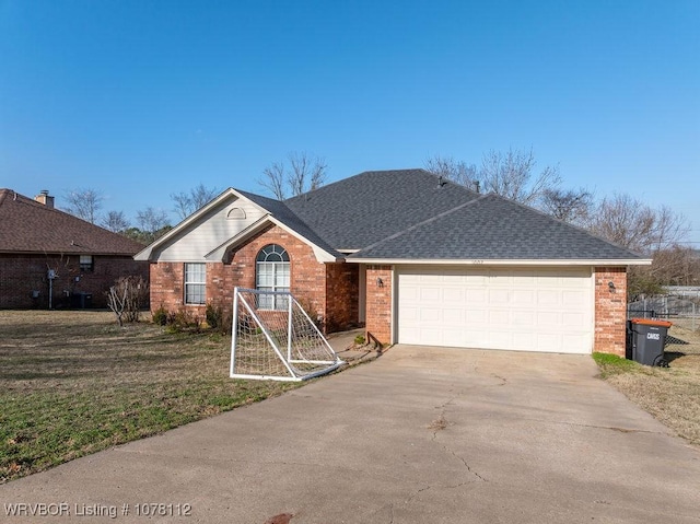 view of front of property featuring a garage and a front yard