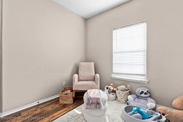 sitting room featuring dark hardwood / wood-style floors