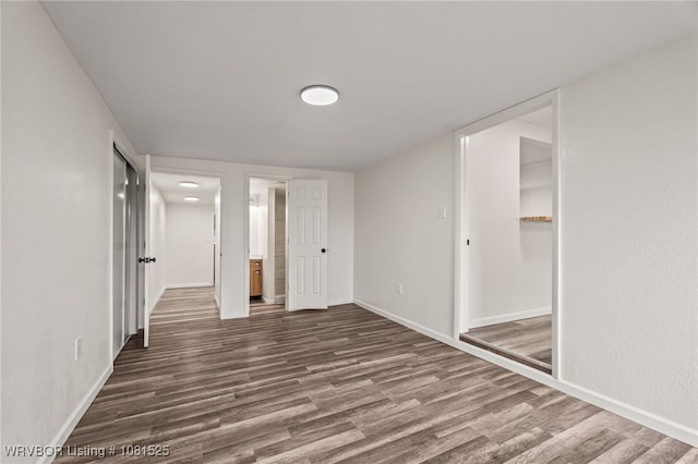 2308 N 50th St, Fort Smith, AR 72904 - unfurnished bedroom featuring dark wood finished floors, baseboards, and a closet