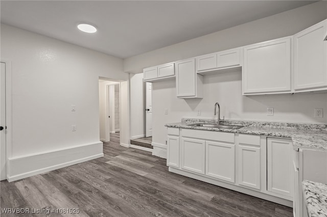 2308 N 50th St, Fort Smith, AR 72904 - kitchen with a sink, white cabinetry, light stone countertops, and dark wood finished floors