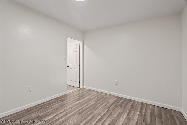 2308 N 50th St, Fort Smith, AR 72904 - empty room with wood finished floors and baseboards
