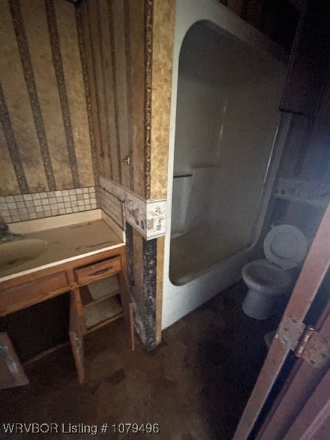 bathroom with toilet and walk in shower