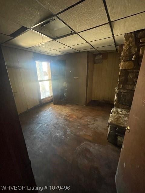 basement featuring a paneled ceiling