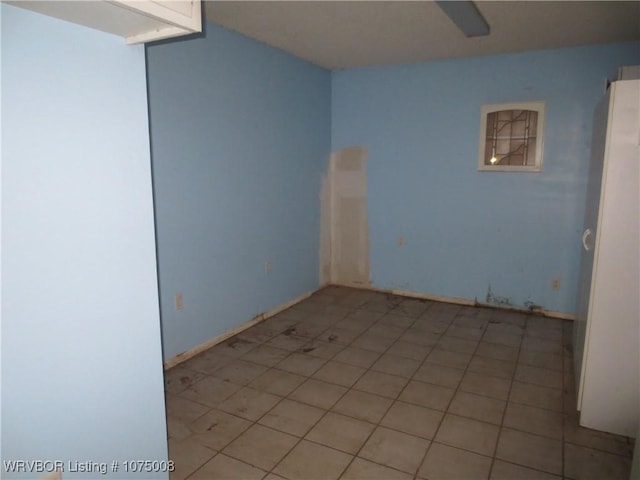 empty room with light tile patterned floors