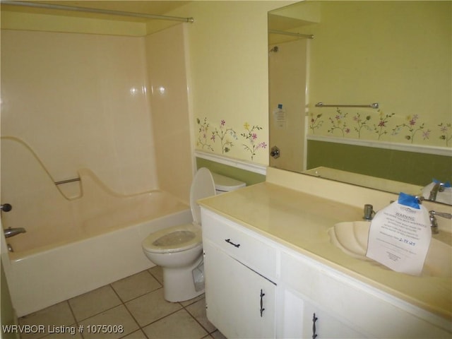 full bathroom featuring tile patterned flooring, vanity, toilet, and shower / washtub combination