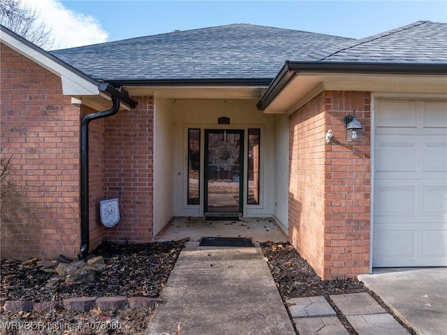 doorway to property featuring a garage