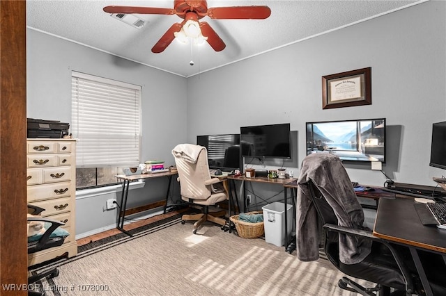 office area featuring ceiling fan and a textured ceiling