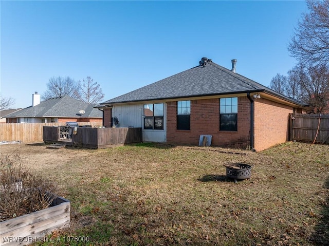 rear view of house with a lawn