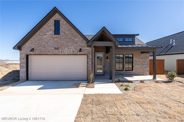 7627 Woodbine Ln, Fort Smith, AR 72916 - view of front of property with brick siding and driveway