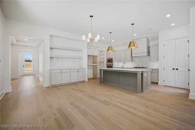 7627 Woodbine Ln, Fort Smith, AR 72916 - kitchen with recessed lighting, stainless steel appliances, backsplash, and light wood finished floors