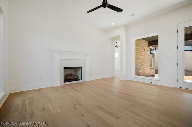 7627 Woodbine Ln, Fort Smith, AR 72916 - unfurnished living room featuring light wood-type flooring, a ceiling fan, a fireplace, and recessed lighting