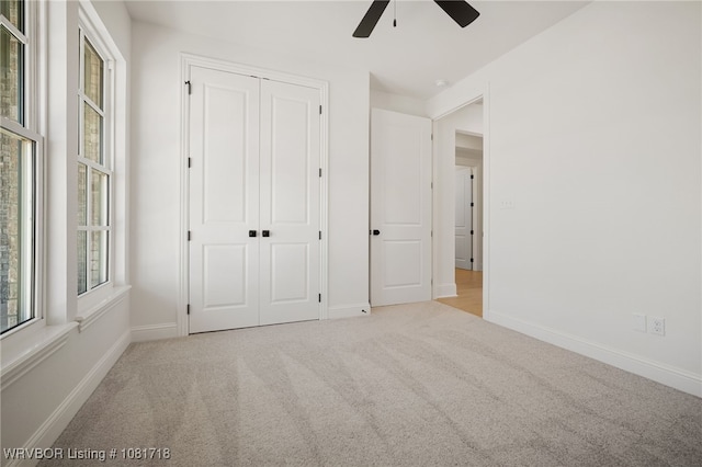 7627 Woodbine Ln, Fort Smith, AR 72916 - unfurnished bedroom with carpet flooring, a closet, and a ceiling fan