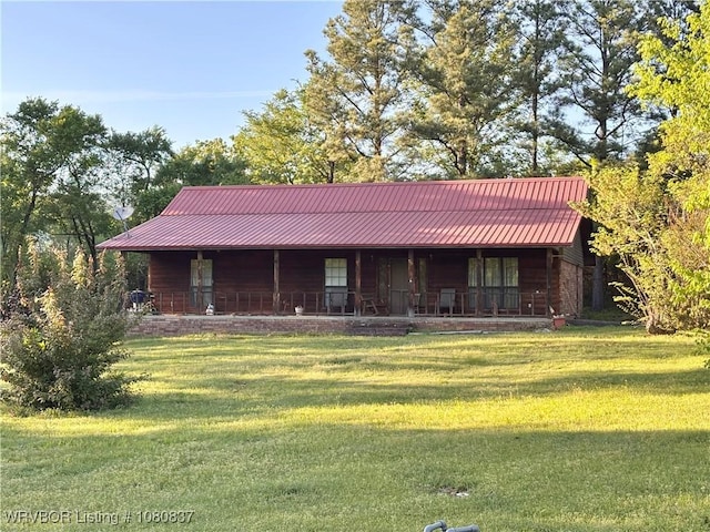 710 E 4th St, Hartford, AR 72938 - view of front facade featuring a porch, metal roof, and a front lawn