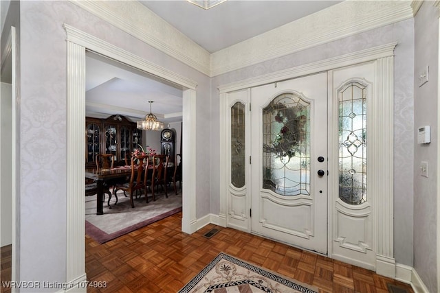 foyer featuring dark parquet flooring