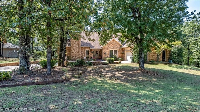 view of front facade with a front yard and a garage