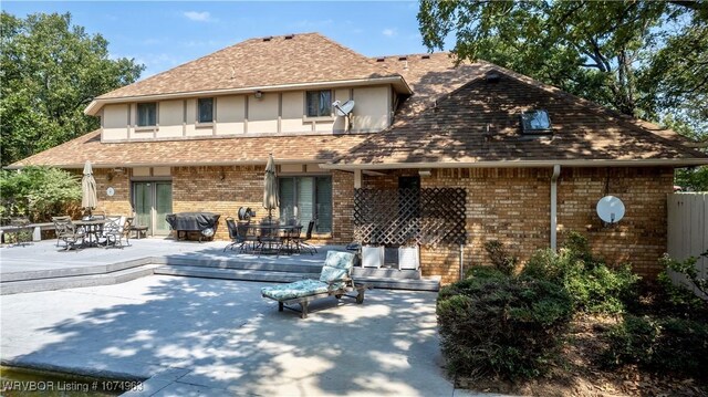 back of property featuring a patio area